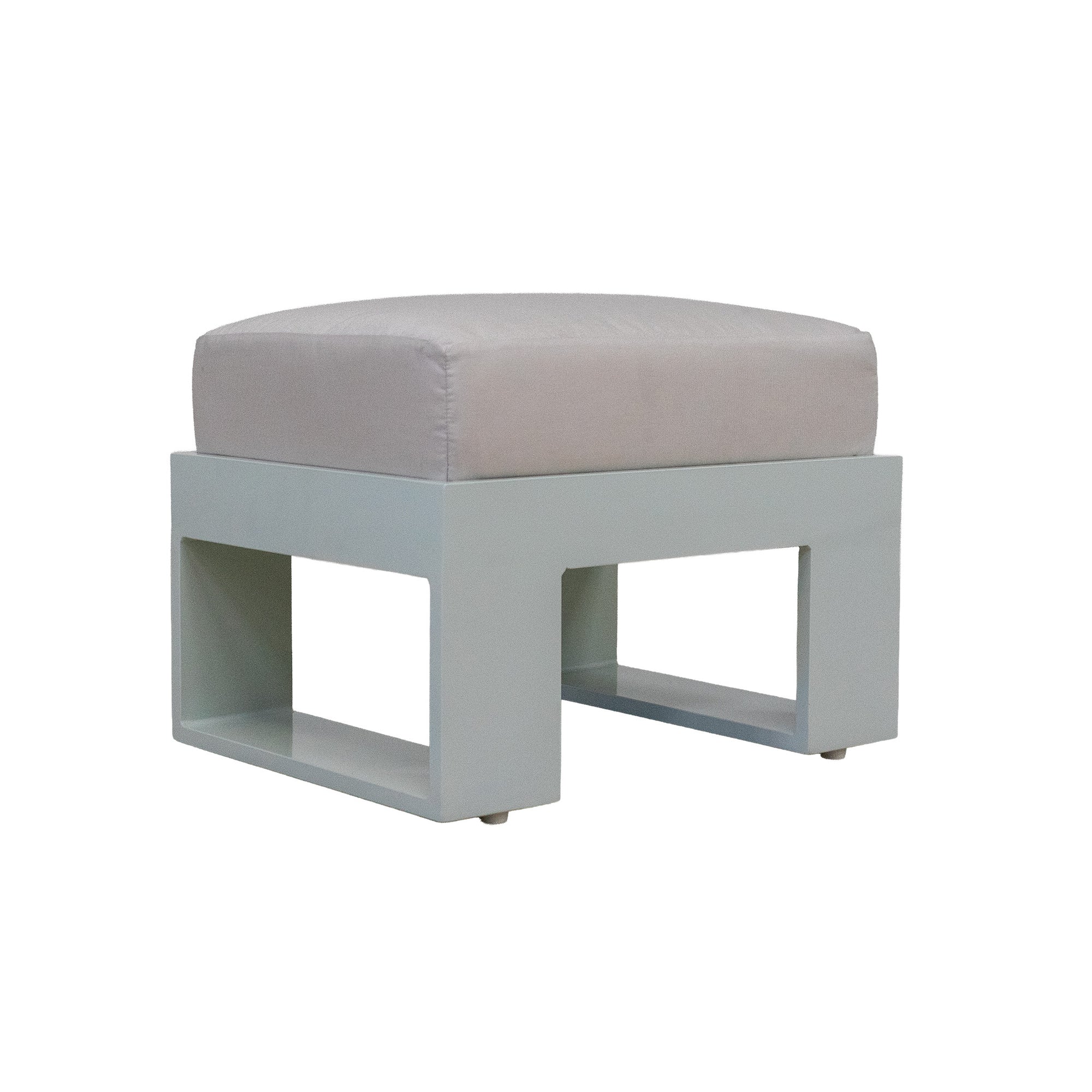 White ottoman with a thick off-white cushion on a white background. 