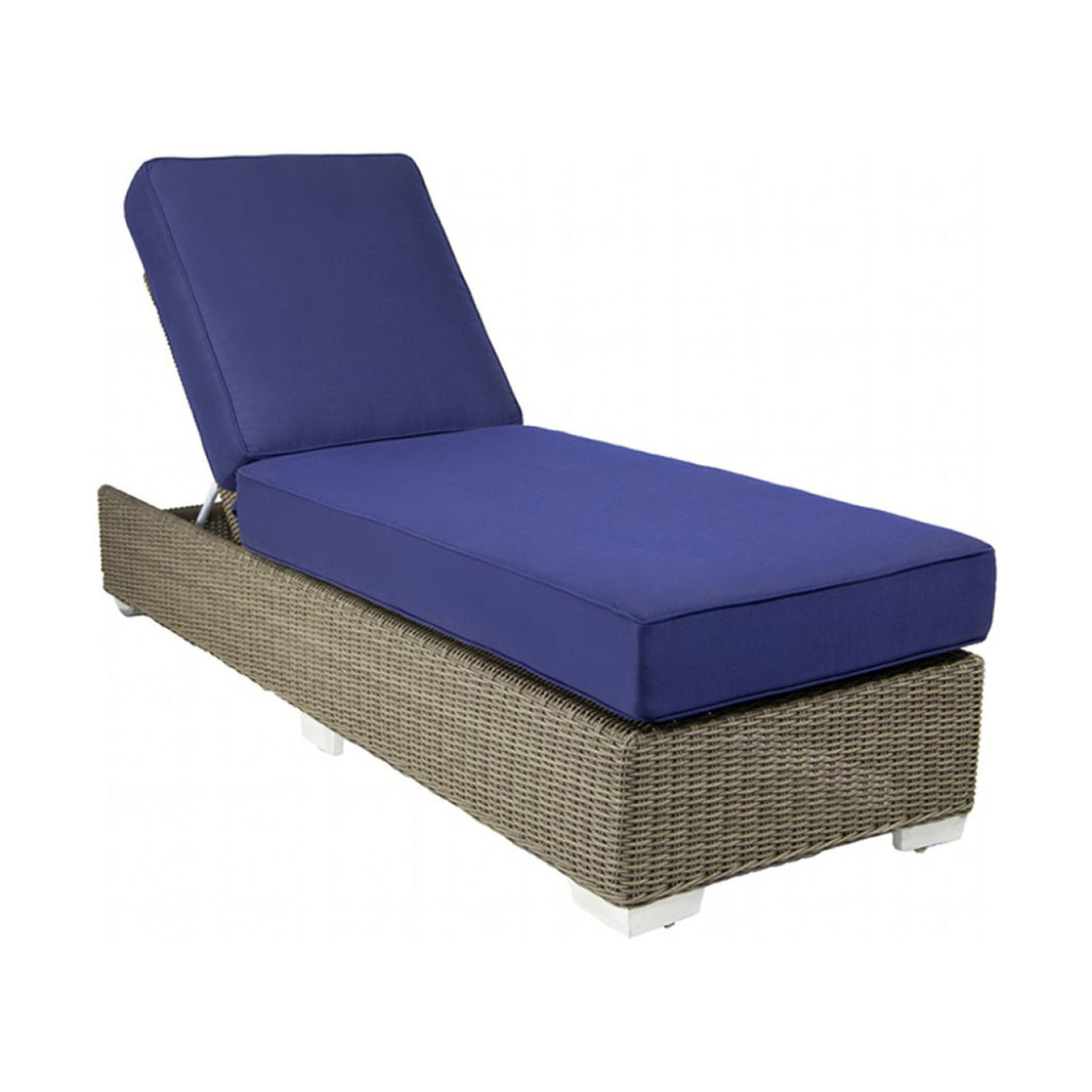 Blue cushioned lounge chair with wicker frame on a white background