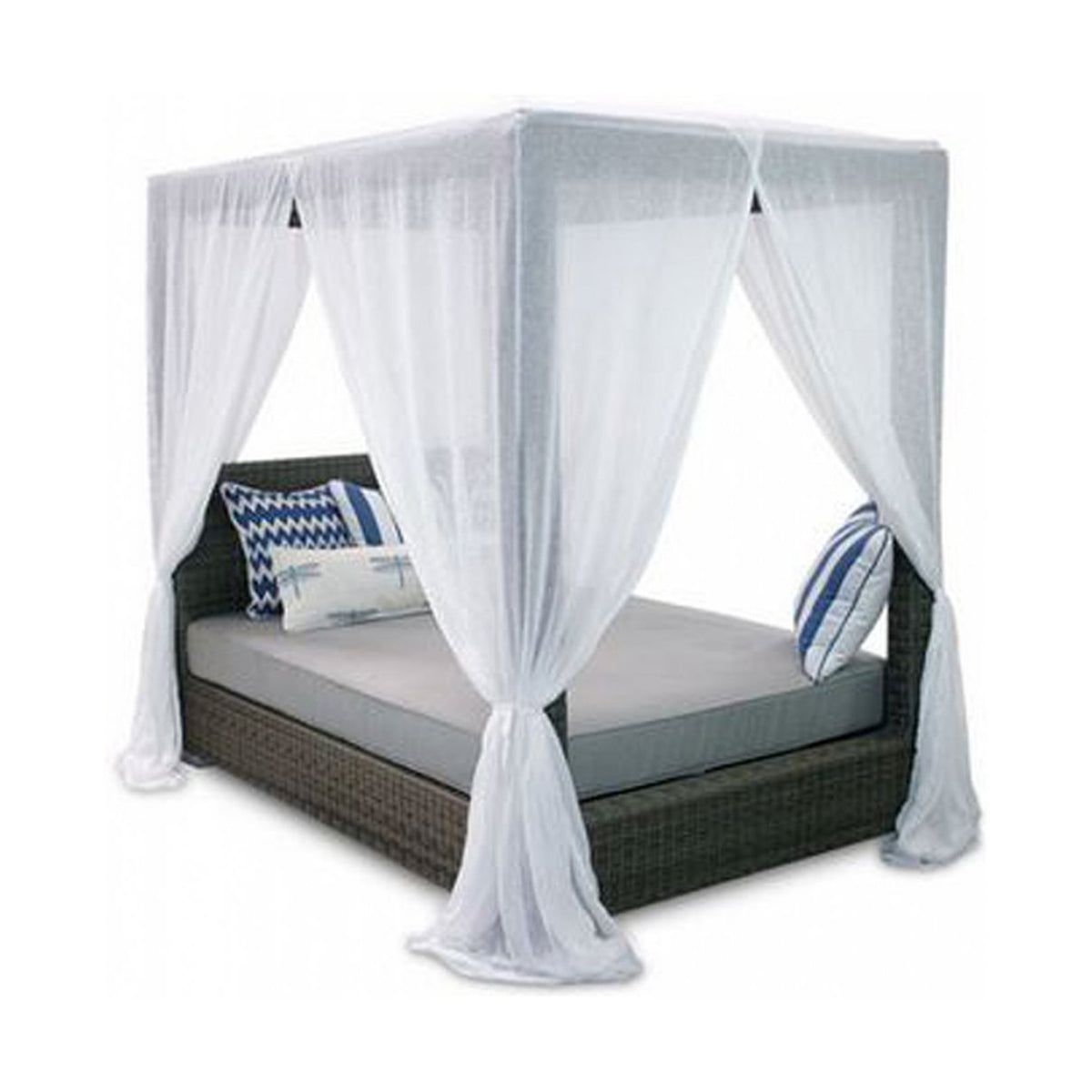 Wicker daybed with sheer white canopy and pillows on a white background