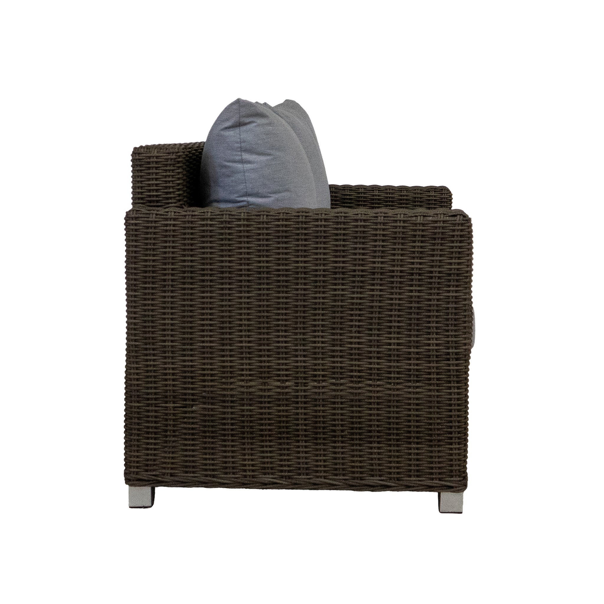 Side view of a brown wicker patio loveseat with a gray cushion on a white background