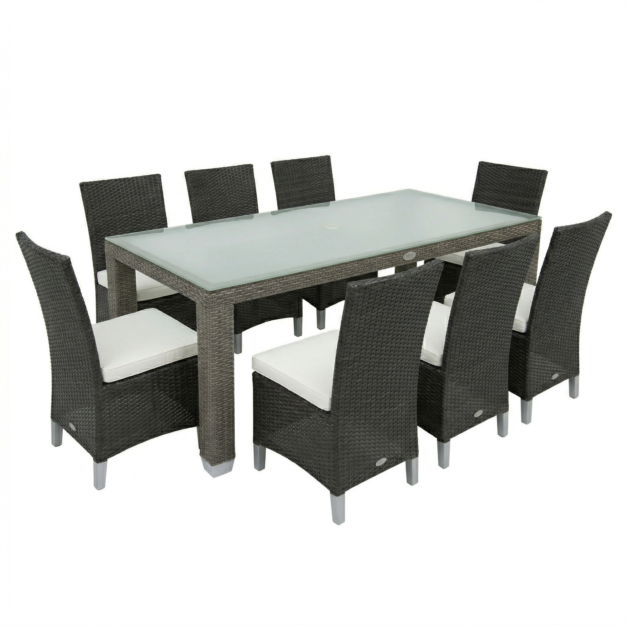 Outdoor dining set with a rectangular table and eight chairs on a white background. Patio set is a dark brown wicker color with a frosted glass top. The dining chairs have a high solid back and white cushions on them. 